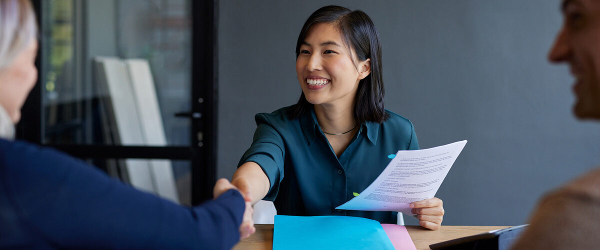 professional woman shaking hand with candidate